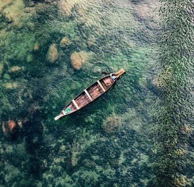 Boating in Umngot River at Dawki - Meghalaya Tour Package